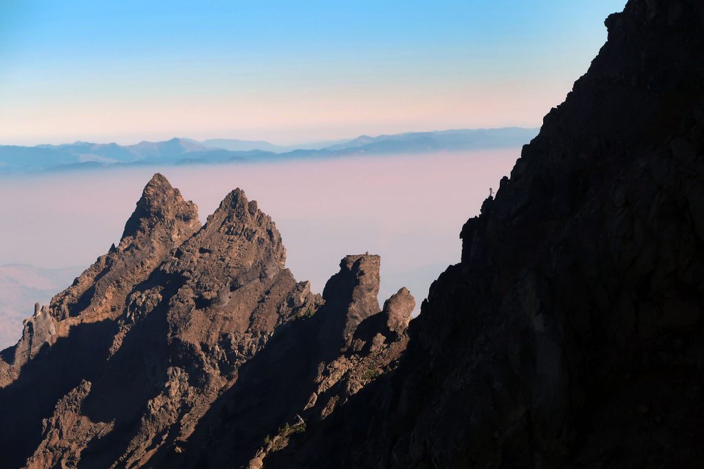 A scene from our traverse across and up the summit ridgeline of Three Fingered Jack. By mid-morning, smoke from nearby wildfires had created a sort of "inversion" masking the valley below.