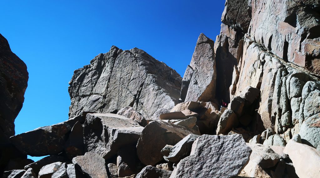 Mount Sneffels' infamous "V Notch" just below the peak. The notch features some "considerable exposure".